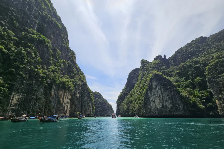 The Phi Phi Islands combine dramatic cliffs with clear waters, making them one of Thailand’s most famous destinations