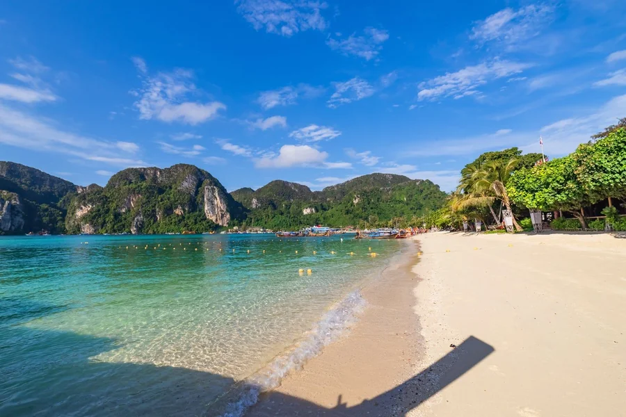 Phi Phi Islands for Brazilian Travelers - Finding A Trusted Partner For Perfect Island Tours 2 Loh Dalum Bay framed by limestone cliffs, is often listed among the most beautiful beaches in Thailand